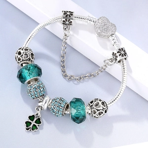 Green crystal beads and silver heart charm bracelet with sparkling zircon details