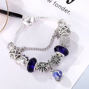 Vintage silver charm bracelet with dark blue glass beads and earth heart charms