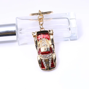 Sparkling red sports car keychain with gold alloy finish and crystals for bags