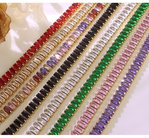 Detail of colorful baguette-cut zircon bracelets in gold-plated stainless steel settings