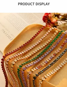 Detail of colorful oval-cut zircon tennis bracelets with gold-plated metal base
