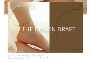 Detail of rose gold 14K anklet with olive link chain design and lobster clasp closure