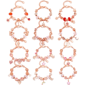 Twelve rose gold plated charm bracelets with rainbow crown and flower pendants in a grid layout