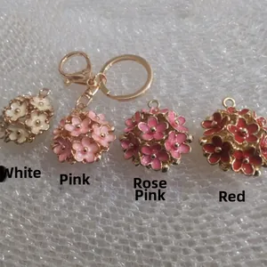 Three-dimensional alloy flower keychain pendants in white, pink, rose pink and red colors