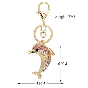Luxury gold dolphin keychain with pink and white rhinestones and dimensions overlay