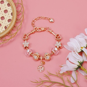 Rose gold beaded bracelet with tree of life charm and pink floral accents detail