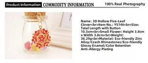 Detailed view of red 3D hollow five-leaf clover keychain with gold chain and dimensions