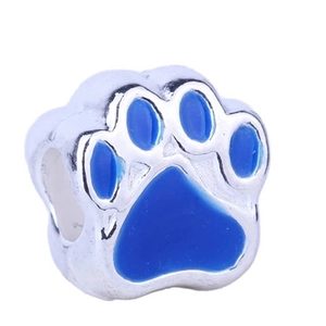 Detail of dog paw bead with blue enamel in silver finish for DIY charm bracelets