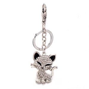 Cute silver cat keychain with sparkling white crystals and black enamel details for bags
