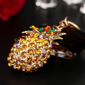 Sparkling crystal pineapple keychain with yellow rhinestones and gold-plated metal base