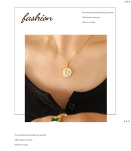 Detailed view of gold Virgo zodiac necklace with white shell pendant on a model