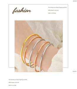 Detailed view of five-piece minimalist titanium steel bangles in gold silver and rose gold