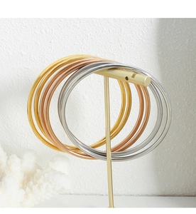 Polished stackable titanium steel bangles in gold, rose gold and silver finishes
