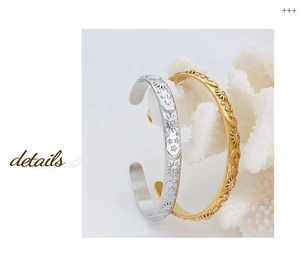 Detail of gold and silver sun moon star embossed bangles with sparkling cubic zirconia