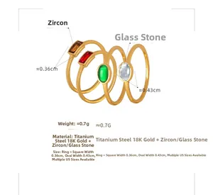 Detail of 18K gold titanium steel rings set with zircon and glass stones