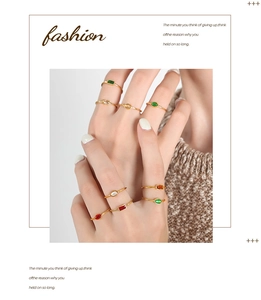 Macro detail of minimalist gold-plated titanium steel rings set with colorful zircons