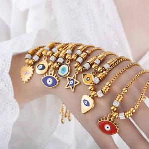 18K gold plated evil eye bracelets with colorful enamel charms and zircon on model's wrist