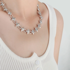 Industrial punk rivet necklace in stainless steel with cone spikes on rectangular links