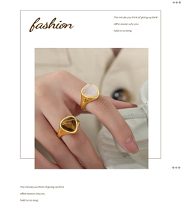 Detail of vintage 18k gold plated ring with natural tiger eye stone inlay