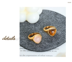 Detailed top view of vintage 18k gold plated titanium rings with tiger eye stone