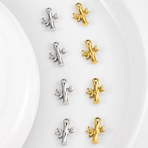 Set of 8 gold and silver bamboo style stainless steel charms with polished finish