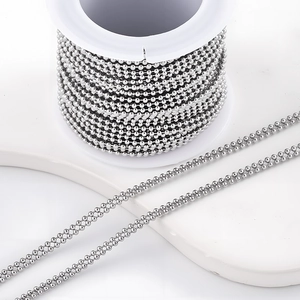 Polished silver stainless steel double bead chain wound on a white spool for DIY jewelry