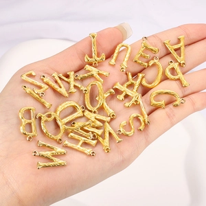 3D stainless steel alphabet pendants in 18K gold finish with hammered texture for DIY jewelry