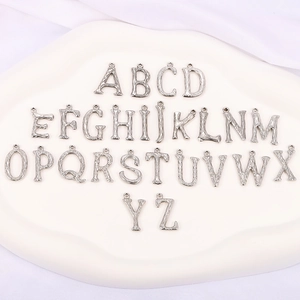 Set of 26 silver alphabet pendants with bark texture for DIY jewelry making