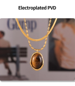 Close-up of double-layer 18K gold-plated necklace with oval tiger eye stone pendant