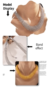 Detailed view of the intricate gold and silver spring-shaped link texture on a metal necklace