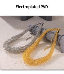 Detailed view of spring-shaped necklaces in gold and silver with PVD electroplating finish