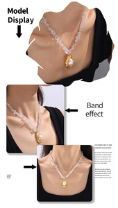 Detail of gold oval pendant with pearl on a crystal碎石 bead necklace worn by model