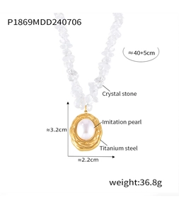 Detail of gold titanium steel oval pendant with imitation pearl and crystal stones necklace