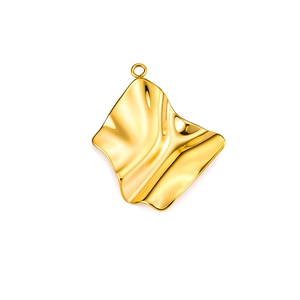 Macro detail of high-polish gold irregular ripple heart pendant with metallic fold texture