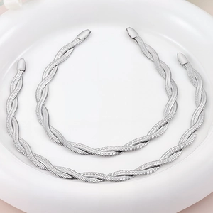 Flat lay of double-layer silver twisted blade snake chain made of stainless steel