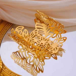 Elegant 18k gold plated stainless steel open cuff bracelet with hollow floral leaf patterns