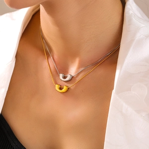 U-shaped pendant necklace set in 18k gold and silver finish with sleek snake chain