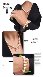 Close-up of pearl necklace and bracelet set featuring a rectangular crystal and number 8 charm