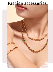 Detail of double-layered gold necklace with colorful zircon stones on female model