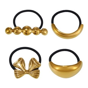 Lot de quatre élastiques à cheveux dorés 18 carats avec nœuds et formes géométriques
