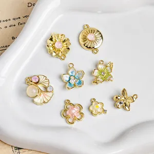 Floral alloy enamel pendants for DIY jewelry making in pink blue and white hues