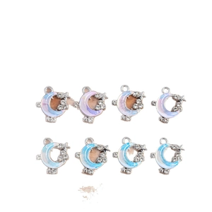 DIY jewelry charms featuring moon and star pendants with zirconia in blue and purple