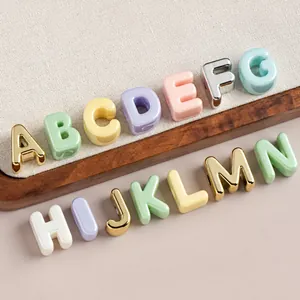 Detailed view of colorful 3D acrylic alphabet beads for DIY jewelry and accessories