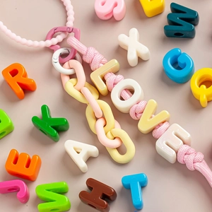 DIY macaron letter beads phone charm with pink woven strap and colorful plastic chain