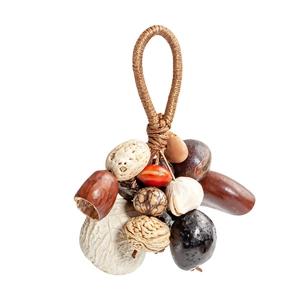 Detail of handcrafted ethnic pendant with assorted natural seeds and woven cord
