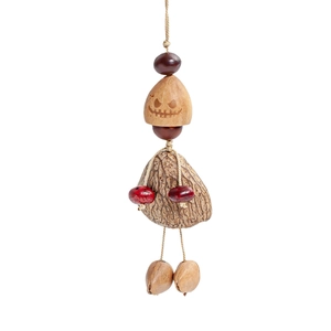 Macro detail of hand-carved pumpkin seed bead with natural wooden beads and red accents