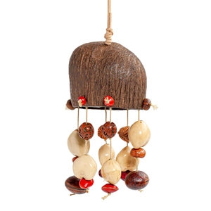 Detailed view of handmade ethnic wind chime with coconut shell and natural seeds