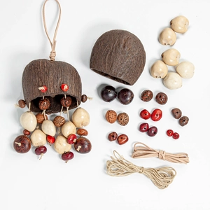 DIY wind chime kit with brown coconut shells, colorful natural seeds and suede cord