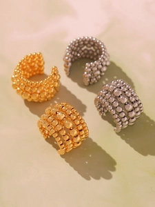 Detailed view of 18k gold and silver plated multilayer bead ear cuffs in C-shape design