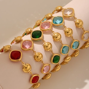 Detailed close-up of colorful square-cut glass stones on a gold stainless steel anklet
